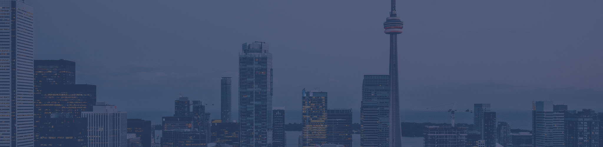toronto-skyline Photograph of downtown Toronto skyline with blue overlay.